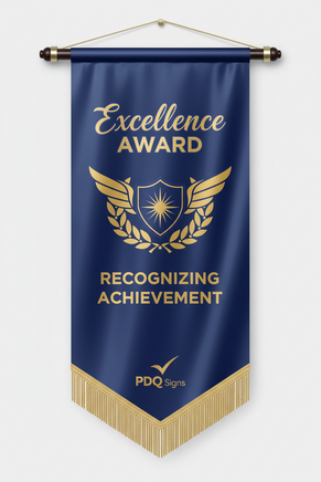 30" x 42" Satin Awards Banners have the highest quality dye sublimation paper transfer print. Banners can be sewn with a wood dowel top and/or bottom, straight or V cut bottom, and with or without fringe. Other options include decorative balls, spear tips, or metal eye hooks for hanging. Material options are Satin or Polyester Poplin (cotton look and feel). Uses include conferences, banquets, ceremonies, awards, and motivational. See page 10 of the catalog for illustrations and more details. PDQ Signs logo 