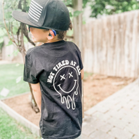 Not Tired At All (w/ Melty X Eye Smiley) - Child Tee