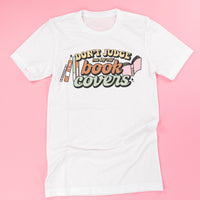 Don't Judge Me By My Book Covers - Unisex Tee