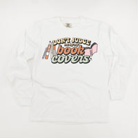 Don't Judge Me By My Book Covers - Long Sleeve Comfort Colors Tee