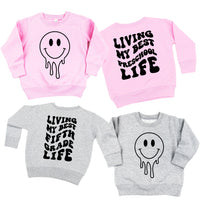 Living My Best (Choose Your Grade) Life - Melty Smiley (f & b) - Child Sweater
