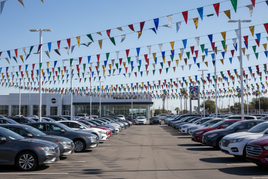 Metallic Pointed Triangle Pennant Strings at a Car Dealership