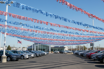 Patriotic Fringe Streamers at a Car Dealership